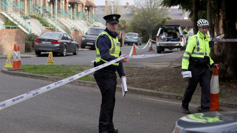 Gardaí at the scene in Rathmines, Dublin, where suspected partial human skeletal remains were found on a tree-lined common area close to apartments. Photograph: Brian Lawless/PA Wire