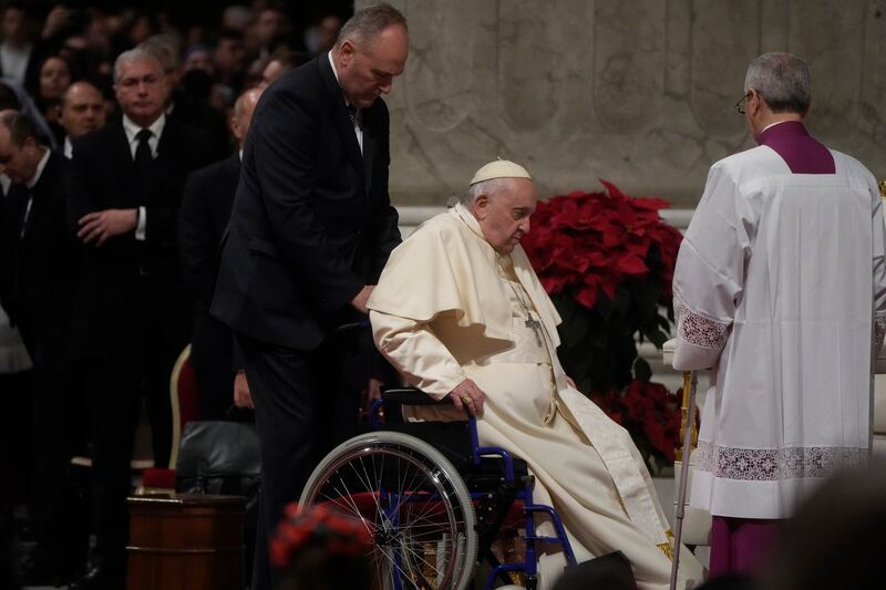 Pope Francis sits in a wheelchair as he presides over Christmas Eve Mass Photograph: Gregorio Borgia/AP/PA