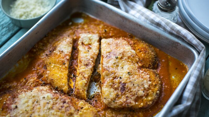 Italian-American classics: chicken Parmesan doused in marinara sauce with grilled cheese on top.