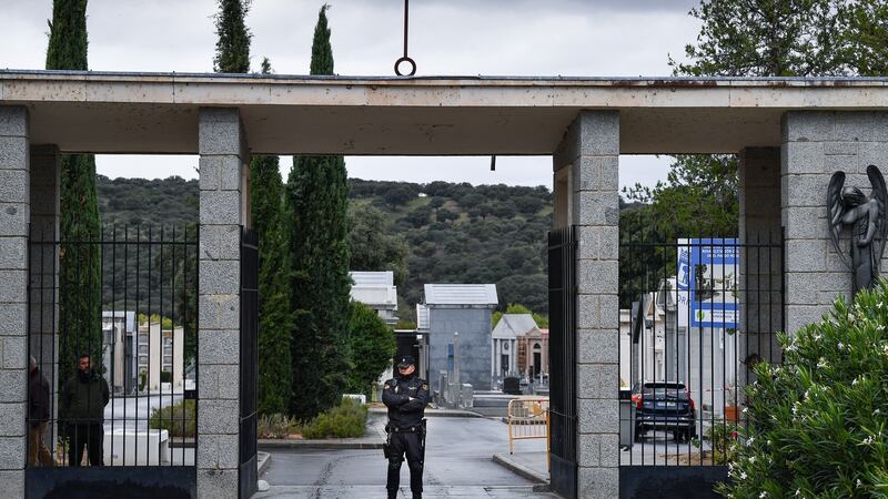 Spanish police stand outside the cemetery  where the remains of Spanish dictator Francisco Franco were to be reburied. Photograph: Jeff J Mitchell/Getty Images