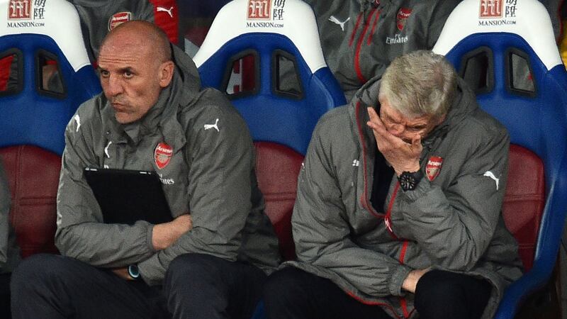 Wenger and assistant Steve Bould look on as Arsenal were beaten. Photo: Glyn Kirk/Getty Images