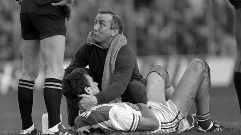 Colm O’Rourke of Ireland recieves treatment from Seán Boylan during the second Test in Croke Park. Photograph: Billy Stickland/Inpho
