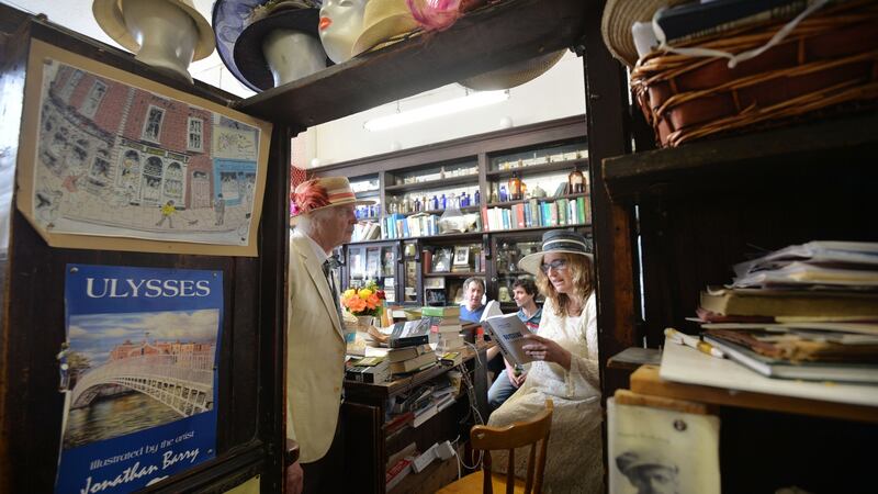 PJ Murphy O’Brien listens as Stella Xenopoulou  reads from  Ulysses as part of a 36-hour reading to mark Bloomsday, in Dublin. Photograph: Alan Betson/The Irish Times