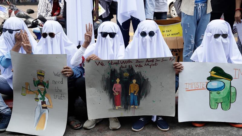 Demonstrators hold placards during a protest against the military coup in Yangon on Saturday. Photograph: Lynn Bo Bo/EPA