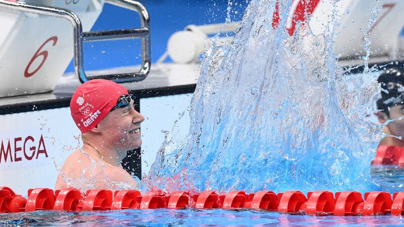 Tom Dean celebrates after winning gold. Photo: Attila Kisbenedek/AFP via Getty Images