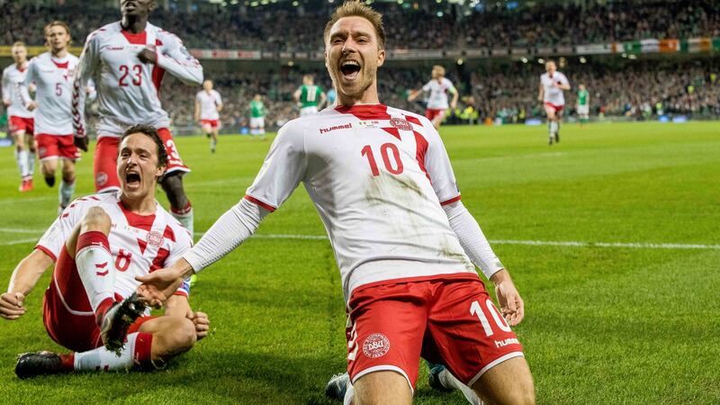 Denmark’s Christian Eriksen celebrates scoring their third goal with Thomas Delaney during the World Cup playoff second leg against Ireland in Dublin. Photograph: Morgan Treacy/Inpho