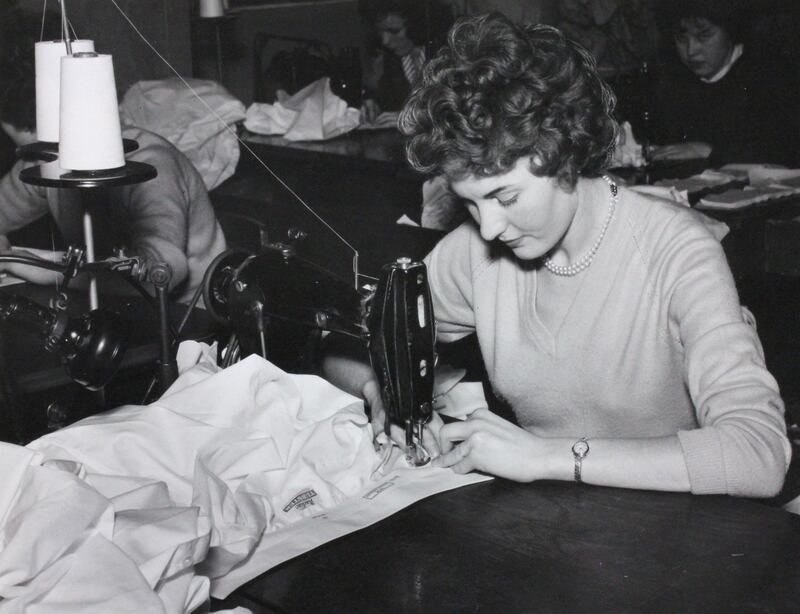 Margaret McCourt, then Margaret Olphert, sewing a shirt collar. Photograph: Courtesy of DCSDC Museum Service (Derry City and Strabane District Council)