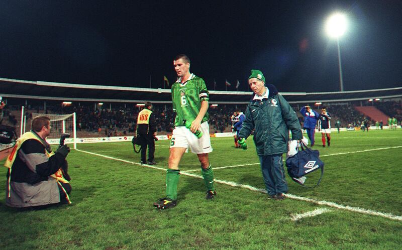 Roy Keane leaving the pitch with Charlie O'Leary after the Yugoslavia vs Republic of Ireland in 1998. Photograph: Patrick Bolger/Inpho