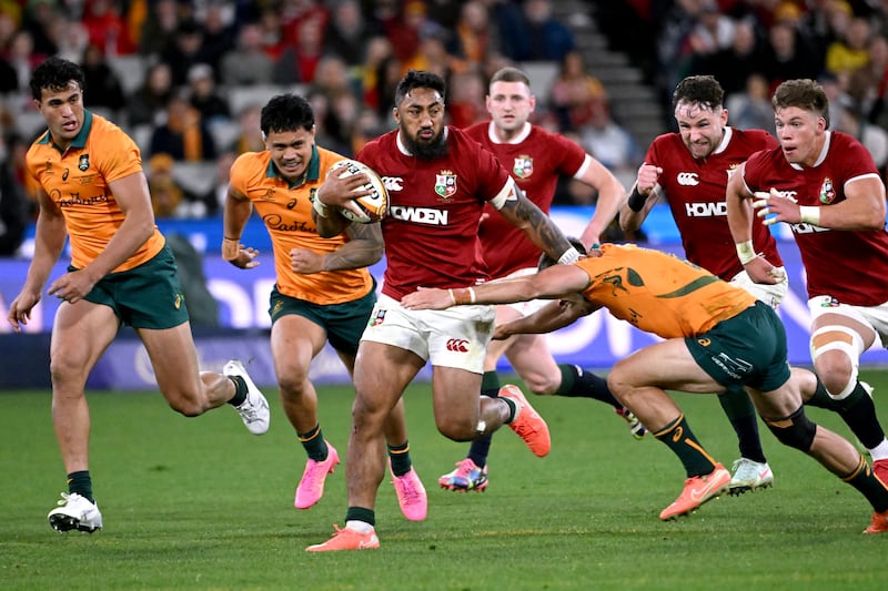 Bundee Aki runs away from Australia's Jake Gordon during the second test in Melbourne. Photograph: William West/AFP via Getty Images      