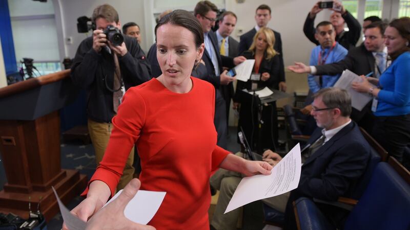 Deputy press secretary Lyndsey Walters hands out documents to reporters in the White House. Photograph: AFP/Mandel Nganmandel/Getty Images