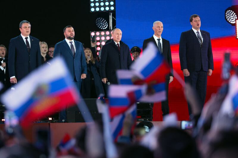 Russian president Vladimir Putin sings the national anthem during a rally and a concert marking the annexation of four regions of Ukraine Russian troops occupy. Photograph: Anton Novoderezhkin/Getty Images
