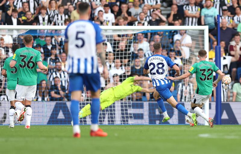 Evan Ferguson curls a delightful finish past Newcastle goalkeeper Nick Pope for his second goal for Brighton in the Premier League win at The AMEX, Brighton. Photograph: Steve Paston/PA 