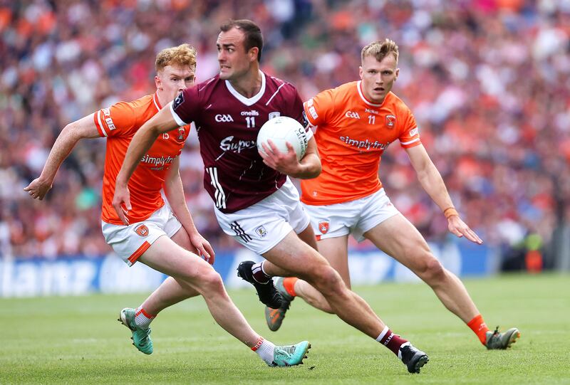 Galway's John Maher eludes both Conor Turbitt and Rian O'Neill of Armagh. Photograph: Bryan Keane/Inpho 