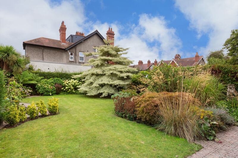 A 'wedding tree' takes centre stage in the south-facing rear garden