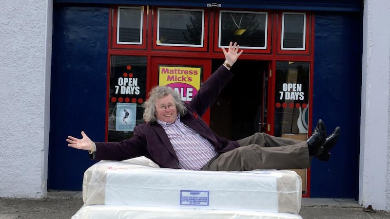 Soft landing: Mattress Mick shows off his wares. Photograph: Dave Meehan
