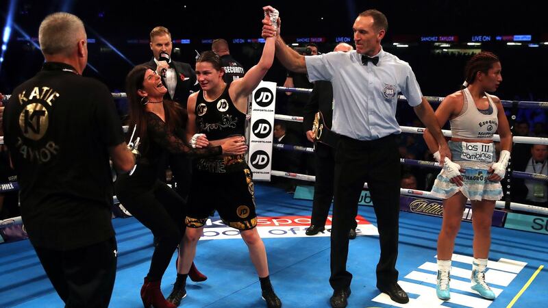 Katie Taylor celebrates victory with her mother Bridget after beating Anahi Esther Sanchez. Photograph: Nick Potts/PA Wire