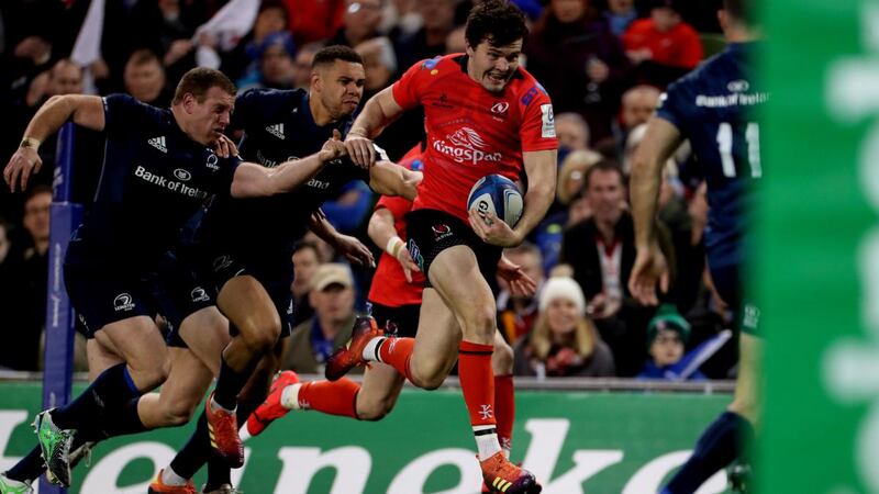 Ulster’s Jacob Stockdale is chased by Leinster’s Sean Cronin and Adam Byrne at the Aviva Stadium. Photograph: Billy Stickland/Inpho