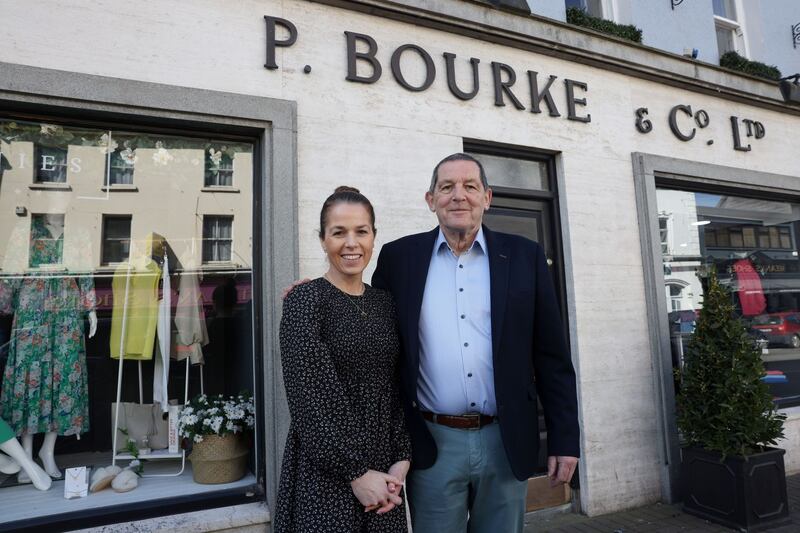 Lonan Burke, owner of P Bourke and Co., and his daughter Leonie pictured outside the family run clothing business in Carrick-on-Suir, Co Tipperary, that was first established in 1806. Photograph : Laura Hutton