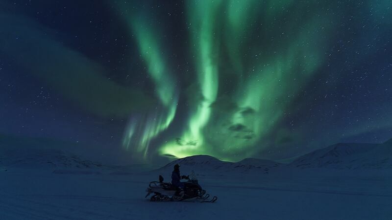A Northern Lights tour, as taken in from a snowmobile on Svalbard. Photograph: Hurtigruten Svalbard