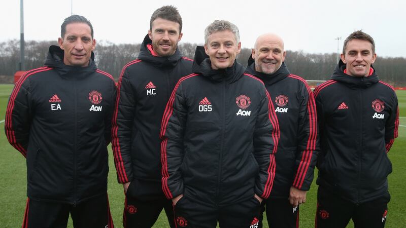 Caretaker manager Ole Gunnar Solskjaer of Manchester United poses with coaches Emilio Alvarez, Michael Carrick, Mike Phelan and Kieran McKenna at Aon Training Complex in Manchester on Friday. Photograph:  Matthew Peters/Man Utd via Getty Images