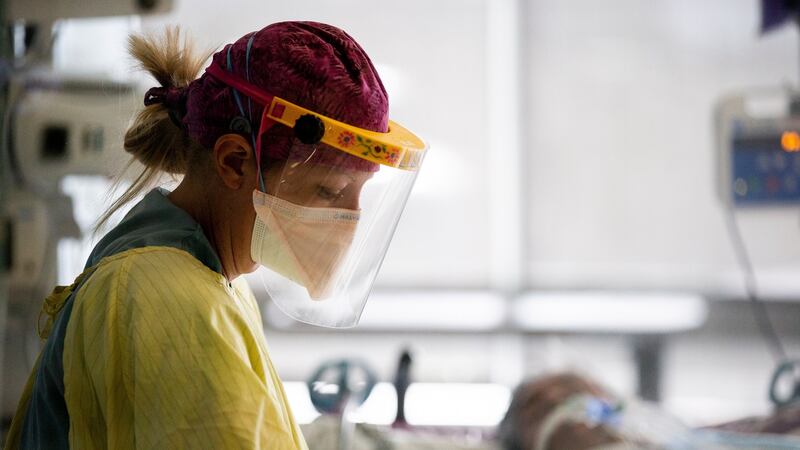 Nurse Lisbeth Brown takes care of a Covid-19 patient in the ICU  of the Sharp Grossmont Hospital, amid coronavirus pandemic in La Mesa, east of San Diego, California this week. Photograph: Etienne Laurent/EPA