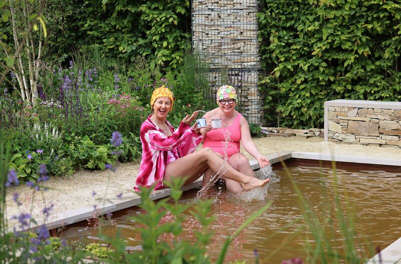 Helena Mulcair and June Curtin from the Snamhaí Sásta swim group enjoy The Coastal Garden. Photograph: Dara Mac Dónaill/The Irish Times