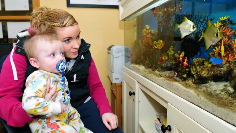 Leanne Gallagher  with her son, Shéa Conachy, aged 10 months, in the Ronald McDonald House in Crumlin, Dublin. Photograph: Aidan Crawley
