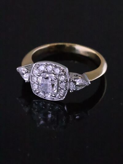 A diamond halo cluster engagement ring (€2,000-€3,000)