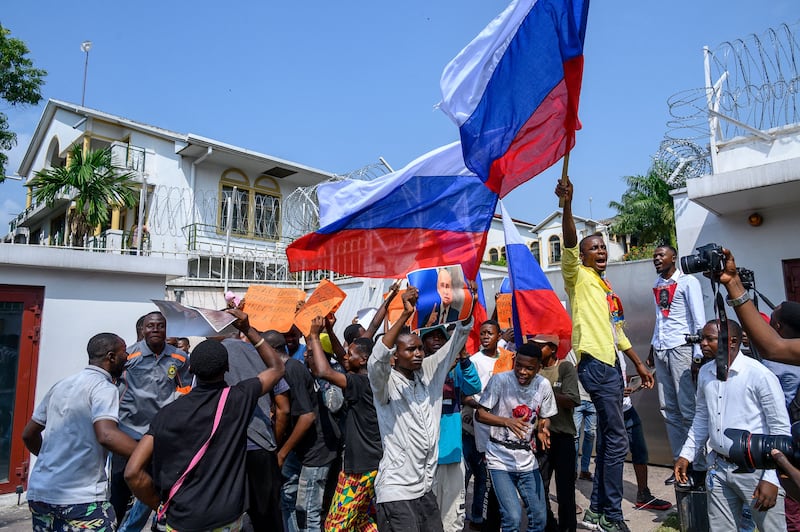 Protesters wave Russian flags at the French embassy in Kinshasa during the visit to the Democratic Republic of Congo of French president Emmanuel Macron in March. Photograph: Arsene Mpiana/AFP via Getty Images