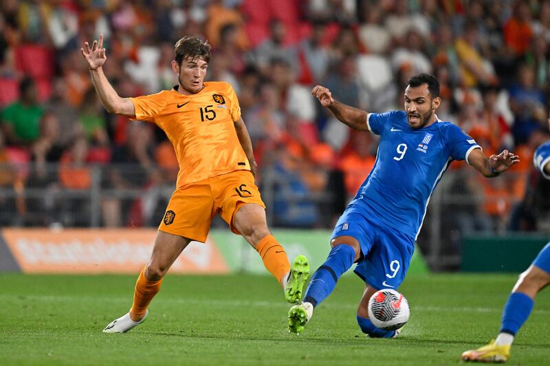 Netherlands' midfielder Marten de Roon  comes under pressure from Greece's Pavlidis during the Euro 2024 qualifier at the Philips Stadium in Eindhoven. Photograph: John Thys/AFP via Getty Images