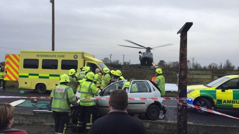 Emergency services work at the scene of the crash. Photograph: Limerick Fire Service