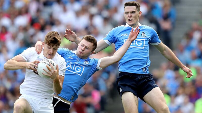 Dublin’s Brian Fenton and Jack McCaffrey with Kildare’s Kevin Feely. Photograph: Inpho
