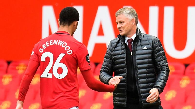 Ole Gunnar Solskjaer congratulates Mason Greenwood after his brace against Bournemouth. Photograph: Peter Powell/AFP/Getty