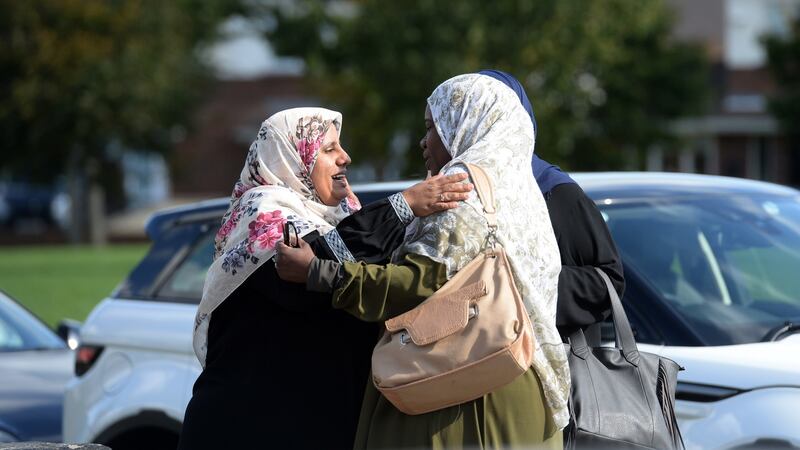 Nosayba Halawa, left, hugs friends as the family celebrate at home in Firhouse. Photograph: Dara Mac Dónaill