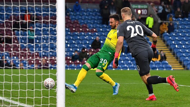Norwich City’s Josip Drmic scores his side’s second against Burnley. Photograph: Anthony Devlin/PA