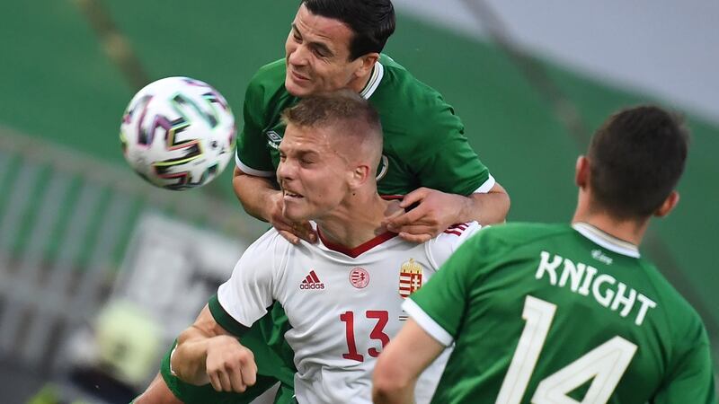 Hungary’s  Andras Schaefer  is challenged by Ireland’s  Josh Cullen during the friendly international against Hungary at the Szusza Ferenc Stadium in Budapest. Photograph: Tibor Illyes/EPA
