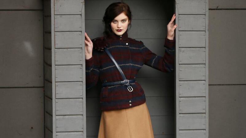 Burgundy and navy plaid jacket Indigo €105, camel A-line skirt €47.50, burgundy tights €8, burgundy Chelsea boots €95, burgundy leather gloves €54, navy belts €7 each at Marks & Spencers