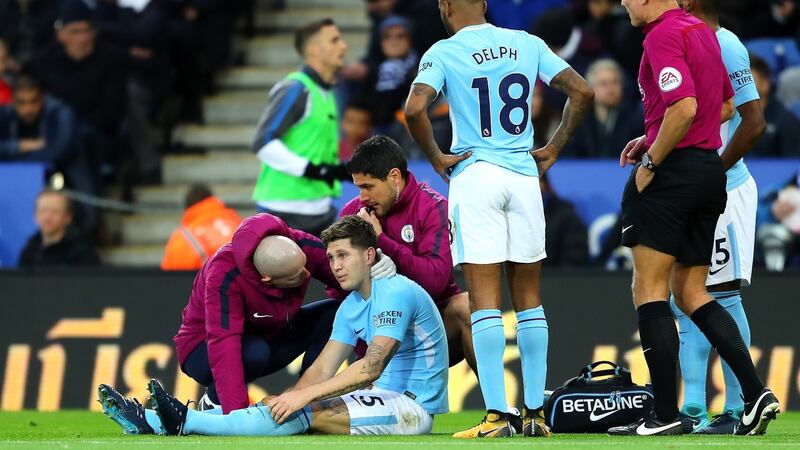 John Stones was forced off with a hamstring injury during Man City’s win over Leicester. Photograph: Richard Heathcote/Getty