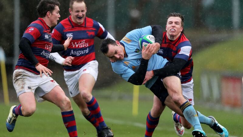 UCD’s Andy Marks is tackled by  Seán Kearns of Clontarf during the Energia All-Ireland League Division 1A game at Belfield on February 29th. Photograph: Brian Reilly-Troy/Inpho