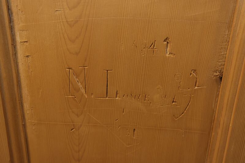 A door into a neighbouring house was discovered in a bedroom during the renovation, while signatures were found on internal doors when their paint was stripped. Photograph: Alan Betson