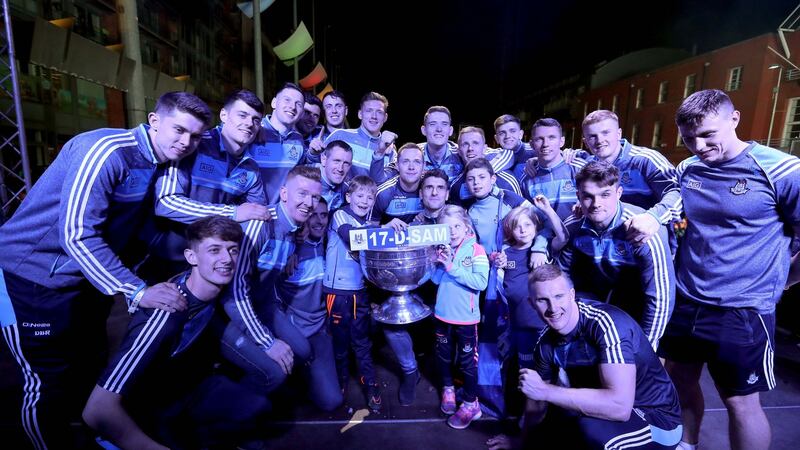 Dublin team celebrate on stage with the Sam Maguire . Photograph: Bryan Keane/Inpho