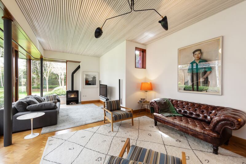 Sittingroom with gas stove and parquet oak floors
