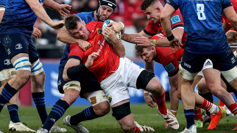 Munster’s Peter O’Mahony is tackled by Caelan Doris of Leinster during the United Rugby Championship match at Thomond Park. Photograph: Dan Sheridan/Inpho