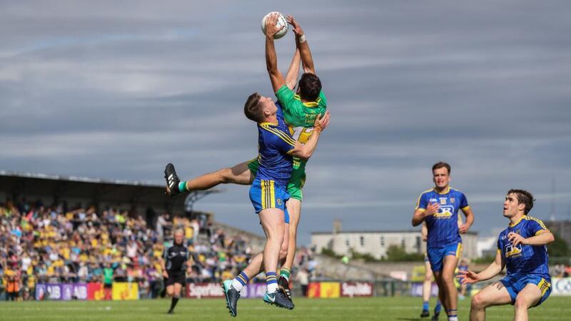 Odhrán Mac Niallais of Donegal gets above  Niall McInerney of Roscommon to claim the ball during the All-Ireland SFC quarter-final Super 8s game at Dr Hyde Park. Photograph: Tommy Dickson/Inpho