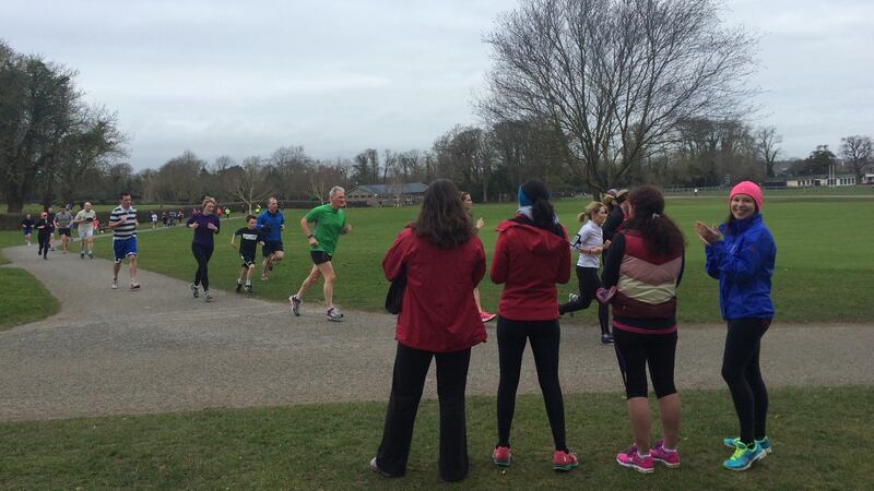 Mary Jennings and others cheering on runners at the Malahide Park Run