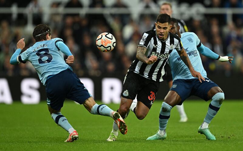 Newcastle United's Bruno Guimaraes vies for possession with Brentford's Mathias Jensen and Frank Onyeka. Photograph: Paul Ellis / AFP via Getty Images
