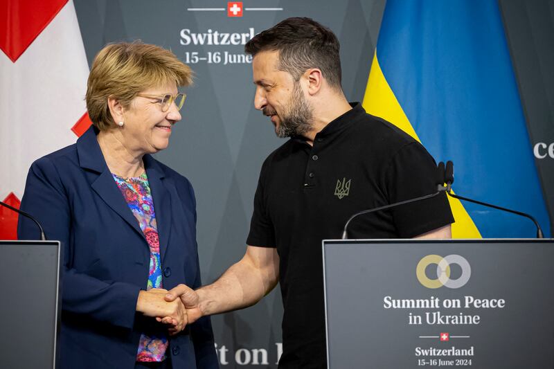 Swiss federal president Viola Amherd shakes hands with Ukraine's president Volodymyr Zelensky during the closing press conference of the Summit on Peace in Ukraine on Sunday. Photograph: Urs Flueeler/AFP