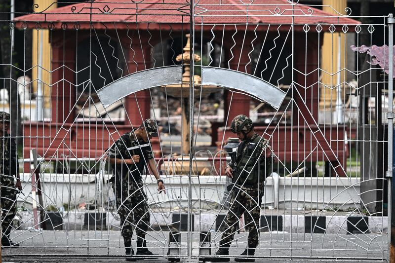 Army personnel stand guard outside the presidential house during a curfew imposed to restore law and order in Kathmandu last week. Photograph: Pedro Pardo/ AFP via Getty Images        