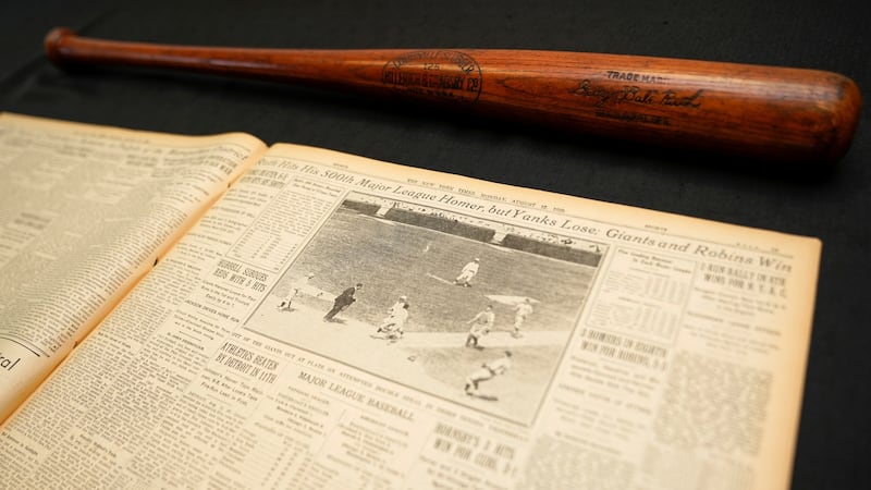 Babe Ruth’s 500th home run bat is shown next to a copy of the next day’s New York Times. Photograph: Reuters/Mike Blake