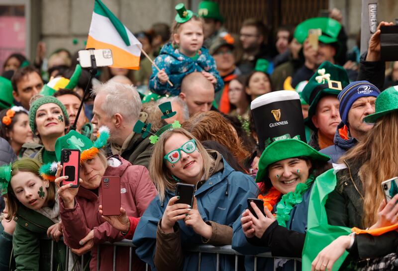 Spectators enjoy the 2023 St Patrick’s Day Parade as it passes through Dublin's city centre. Photograph: Alan Betson